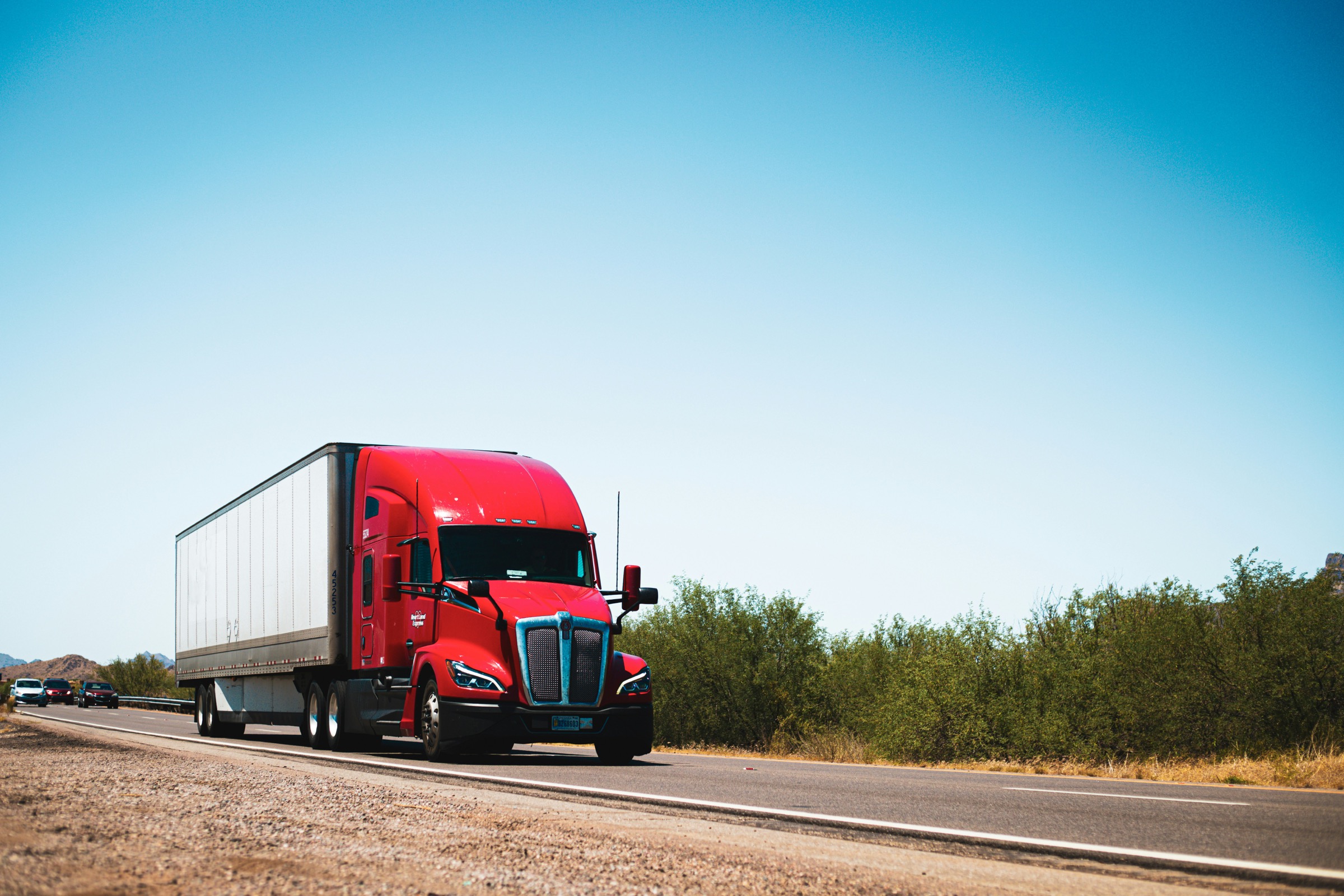 Red moving truck on the road