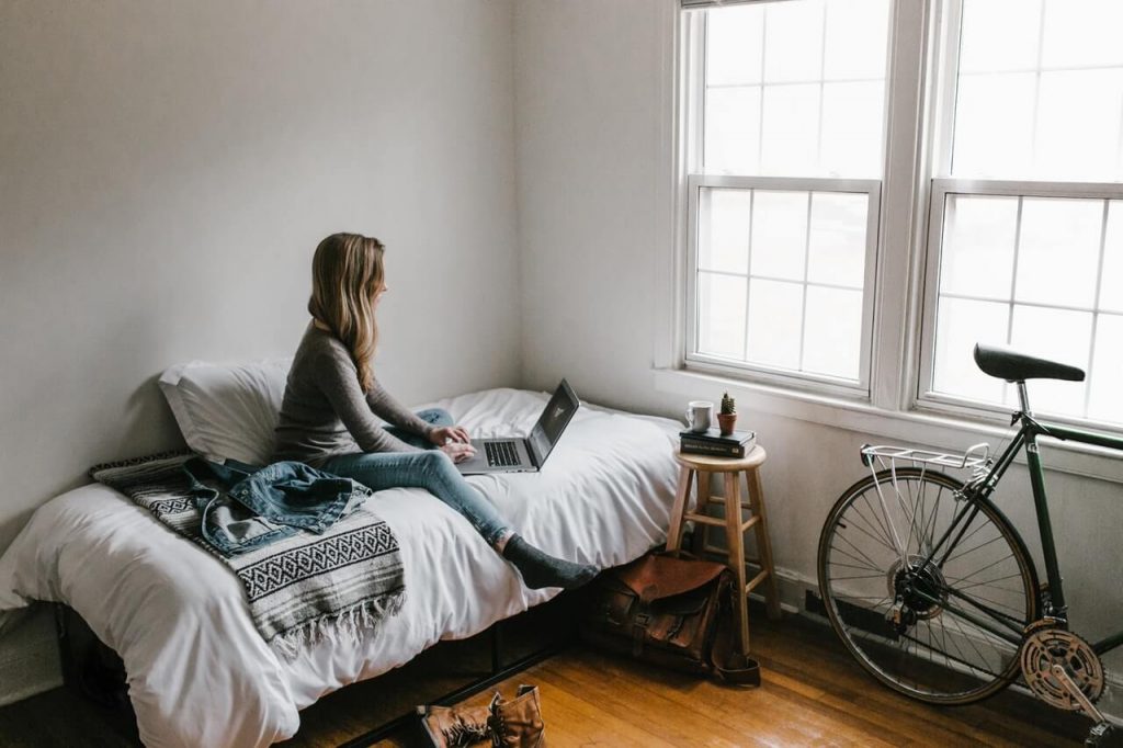 woman-in-gray-shirt-sitting-on-bed-3954635 (1)