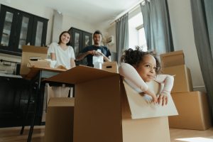 family learning how to unpack after moving