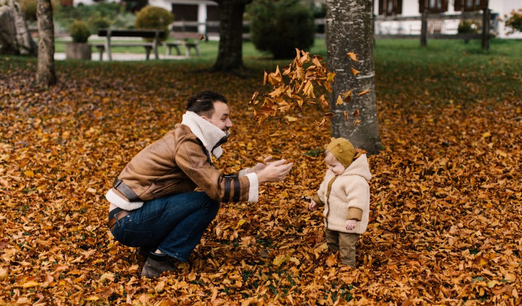 Cheapest Places to Live in Canada in with the Best Quality of Life – 2022 Man playing with a baby in one of the cheapest places to live in Canada with the best quality of life in 2022