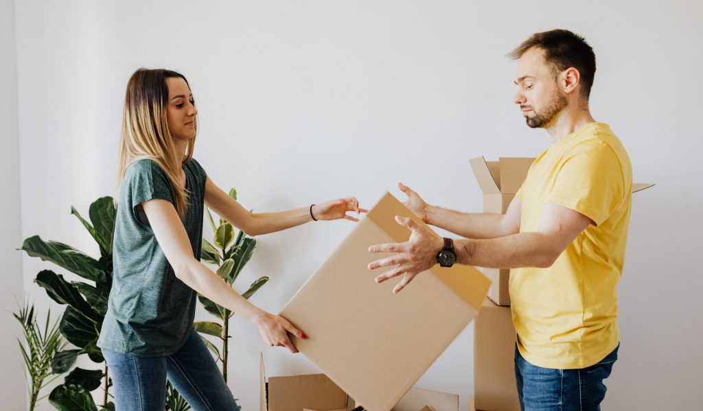 How to Pack a Moving Truck- Our Best Packing Tips couple learning how to pack a moving truck