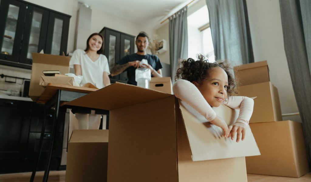 How to Unpack After Moving- A Step by Step Guide family learning how to unpack after moving