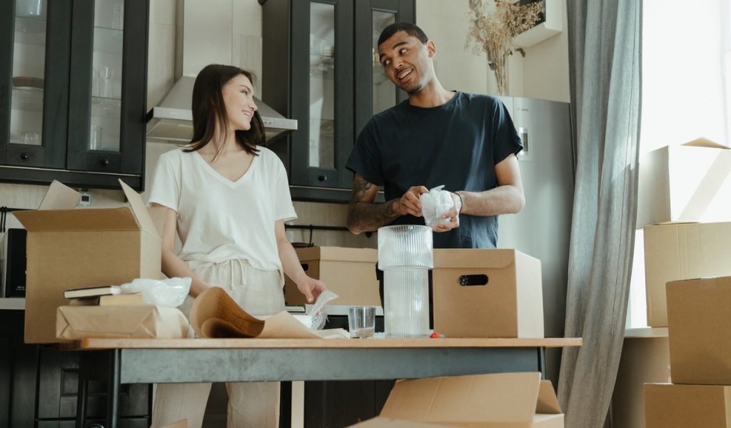 11 Essential Moving Day Tips and Hacks People applying their 11 moving day tips and hacks